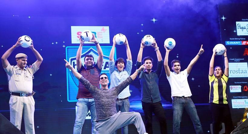 Akki poses with the young football fans
